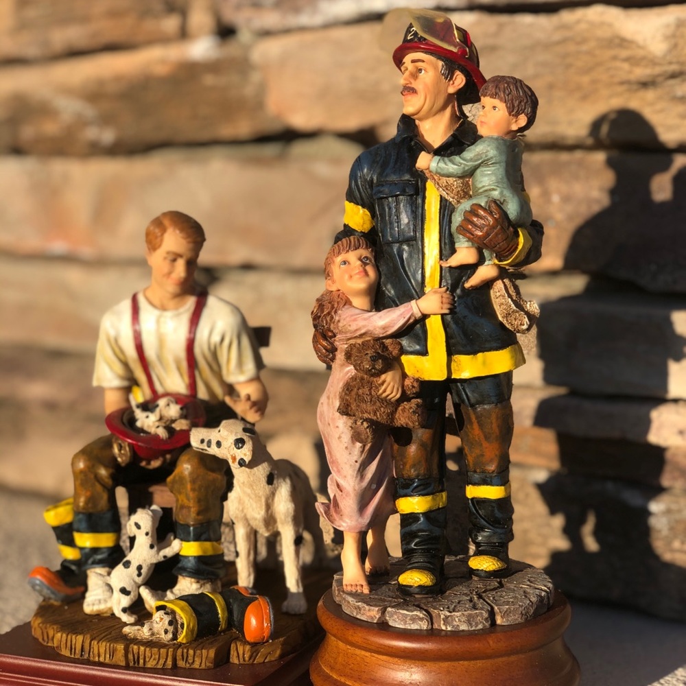 Two Firman Statues NWT By  Red hats of courage
